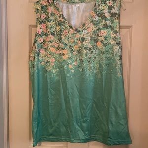 Beautiful green sleeveless top with floral design on top half